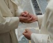 Former pope Benedict is greeted by Pope Francis during a ceremony to mark his 65th anniversary of ordination to the priesthood at the Vatican