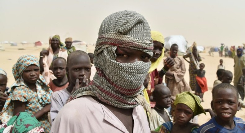 A boy looks on in a camp in the village of Kidjendi near Diffa on June 19, 2016 as displaced families fled from Boko Haram attacks in Bosso