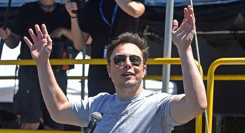 elon musk hands up