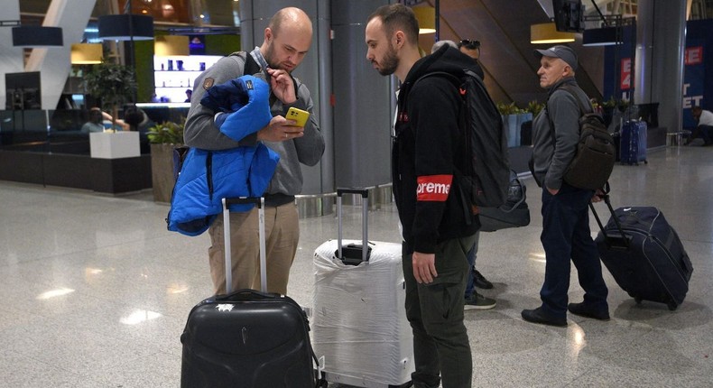 Russian men arrive at Zvartnots Airport in Yerevan, Armenia, on September 21, 2022.