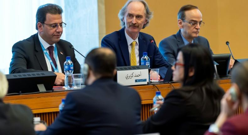 UN Syria envoy Geir Pedersen flanked by  metting co-chairs Ahmad Kuzbari (l) and Hadi Albahra in Geneva