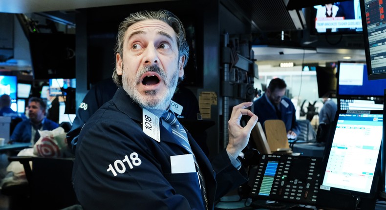 Traders work on the floor of the New York Stock Exchange.
