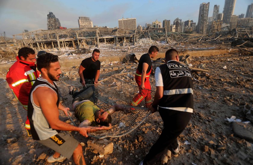 Damaged vehicle and buildings are pictured near the site of Tuesday's blast in Beirut's port area