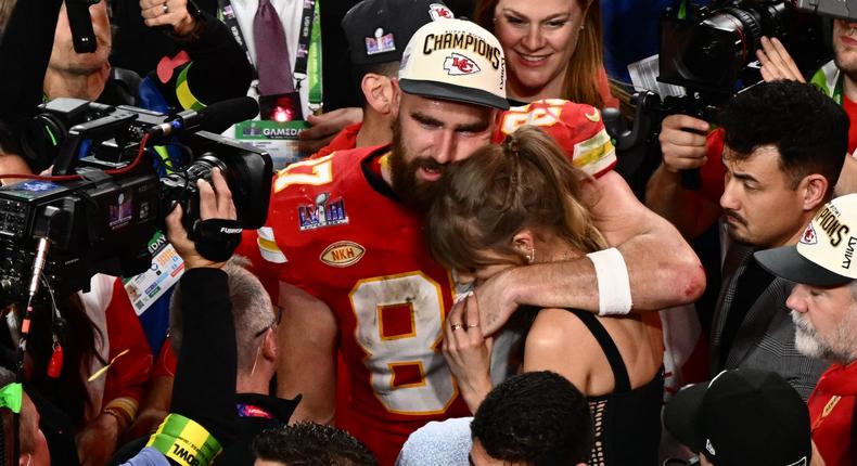 Travis Kelce and Taylor Swift hug at the 2024 Super Bowl.Patrick T. Fallon/AFP via Getty Images