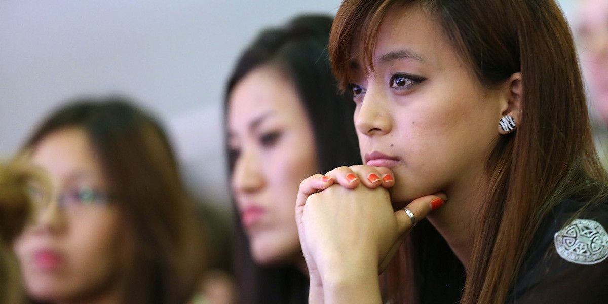 Asian-American students listen to the Dalai Lama speak at Hunter College.