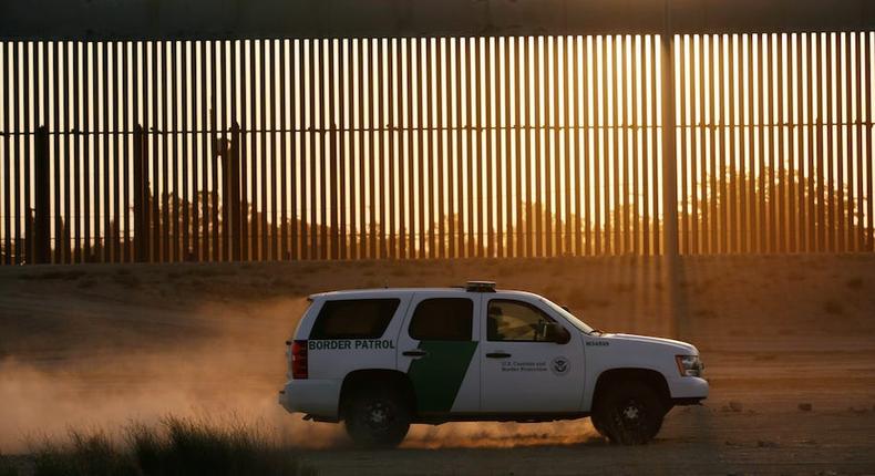 A US Customs and Border Protection vehicle patrols a new section of the border wall in El Paso, Texas.