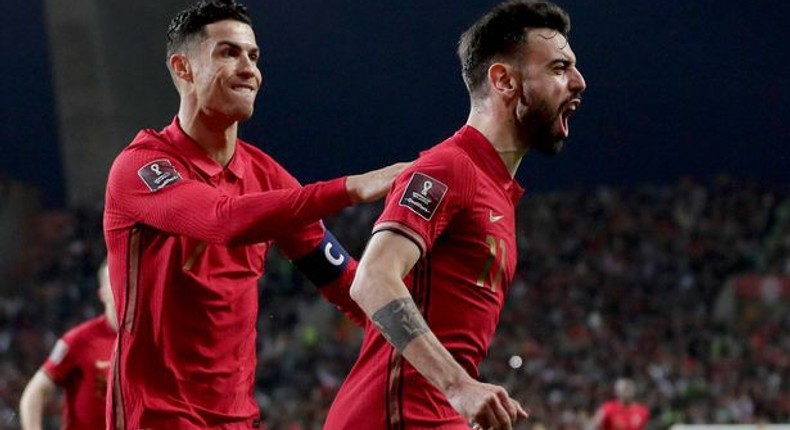 Bruno Fernandes and Cristiano Ronaldo celebrating a goal for Portugal