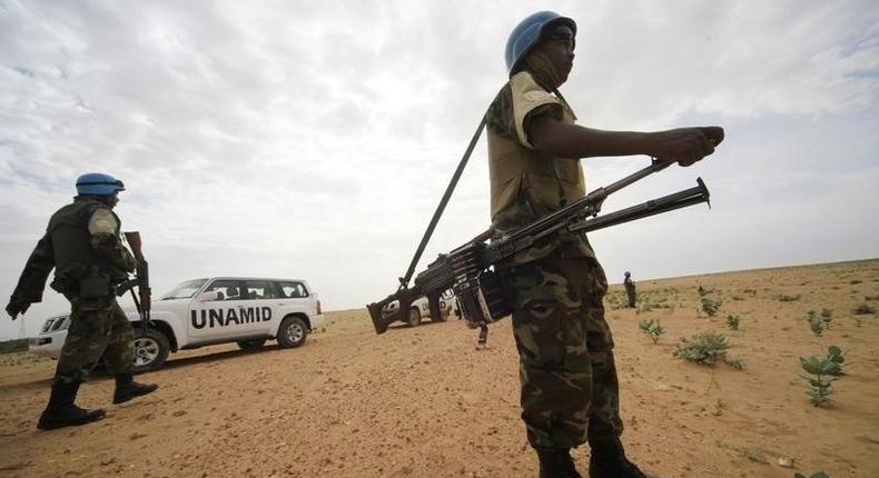 UNAMID peacekeepers stand guard as a delegation of Ambassadors of European Union to Sudan visits a women development program centre funded by World Food Programme (WFP) at Shagra village in North Darfur October 18, 2012. REUTERS/Mohamed Nureldin Abdallah