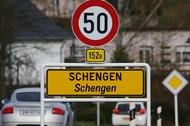 A street sign marks the beginning of the small Luxembourg village of Schengen