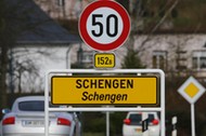 A street sign marks the beginning of the small Luxembourg village of Schengen