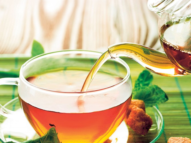 13689_stock-photo-pouring-herbal-tea-shutterstock_51367807
