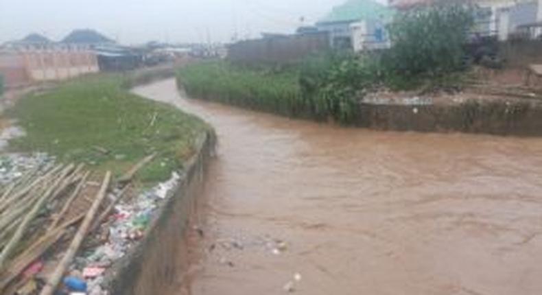 A flooded canal in Ekoro axis of Alimosho Local Government Area of Lagos State on Sunday. [NAN]