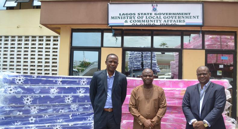 From Left: Chief Operating Officer, Mouka, Femi Fapohunda; with the Permanent Secretary, Ministry of Local Government and Community Affairs, Dr. Taiwo Olufemi Salaam; and Chief Commercial Officer, Mouka, Dimeji Osingunwa; during the donation of 500 mattresses to Lagos State Government, for the enhancement of COVID-19 isolation centre, at Alausa Secretariat on Monday, March 30, 2020, in Lagos.