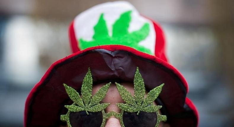 A man, wearing a marijuana-themed hat and sunglasses, is pictured at the Vancouver Art Gallery during the annual 4/20 day, which promotes the use of marijuana, in Vancouver, British Columbia April 20, 2013.  REUTERS/Ben Nelms