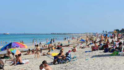 Beachgoers take advantage of the opening of South Beach on June 10, 2020, in Miami Beach, Florida.