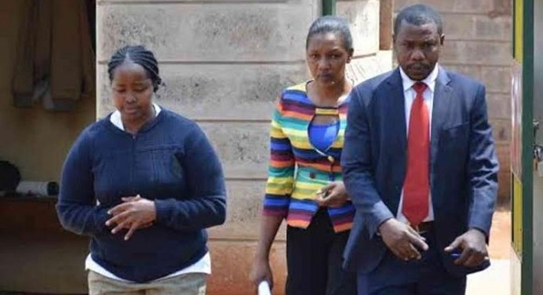 The suspect, Ann Mbaith (Left) being led to a court