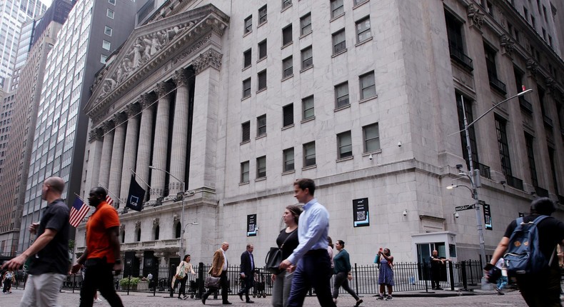 People walk near the New York Stock Exchange.Leonardo Munoz/VIEWpress via Getty Images