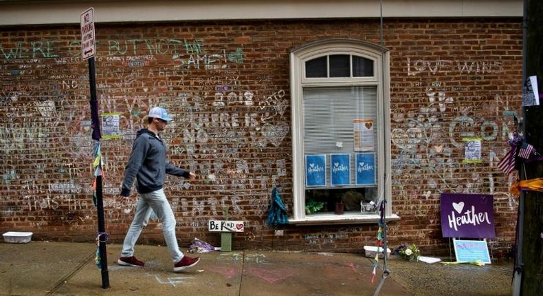 A man walks past a memorial to 32-year-old Heather Heyer, as James Fields -- an avowed neo-Nazi -- goes on trial over her death in Charlottesville in August 2017