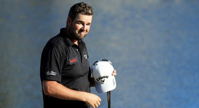 Marc Leishman of Australia celebrates on the 18th green after finishing 11 under to win during the final round of the Arnold Palmer Invitational on March 19, 2017 in Orlando, Florida