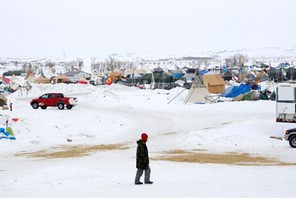 A man walks through the Dakota Access Pipeline protest camp on the edge of the Standing Rock Sioux R