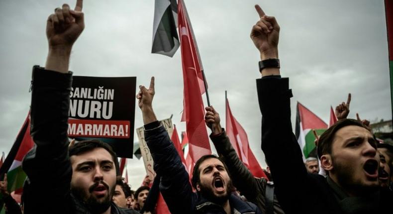 Protesters hold placards and shout anti-Israeli slogans during a demonstration in Istanbul in October