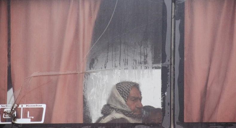 A Syrian man aboard an evacuation bus from government-held Fuaa and Kafraya arrives at a marshalling point in rebel-held Rashidin on April 14, 2017