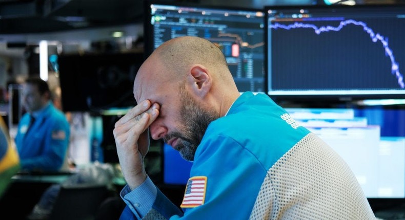 Traders work on the floor of the New York Stock Exchange (NYSE) on March 18, 202