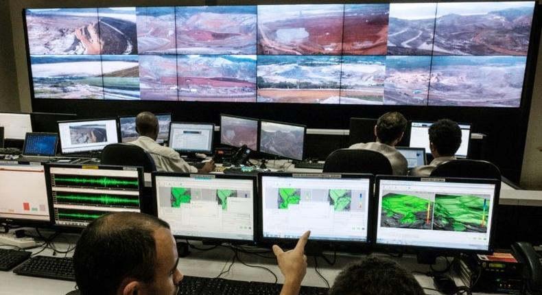 Employees of Brazilian mining company Samarco monitor rebuilding sites at the security control room in their mining site in Mariana, Minas Gerais State, southern Brazil, on October 26, 2016