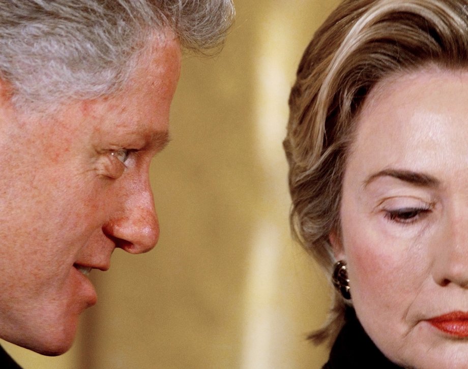 President Bill Clinton whispers to first lady Hillary Clinton during an event at the White House in this February 5, 1999 file photo.