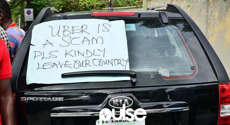 Uber drivers protest price cuts in Lagos.