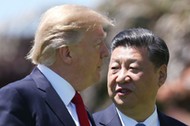 U.S. President Trump and China's President Xi walk together at the Mar-a-Lago estate after a bilater