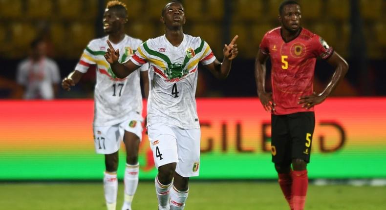 Amadou Haidara (C) celebrates scoring for Mali against Tunisia in Ismailia