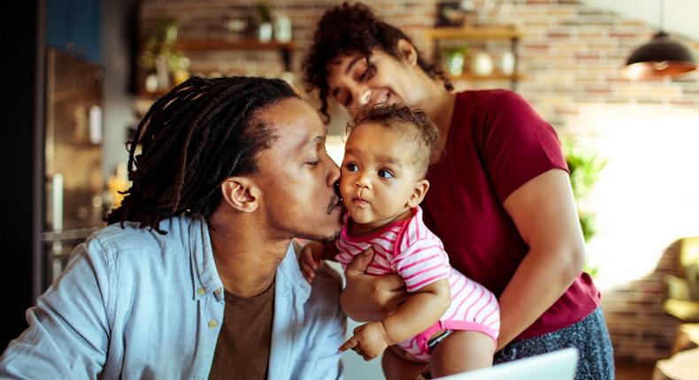 father kissing daughter