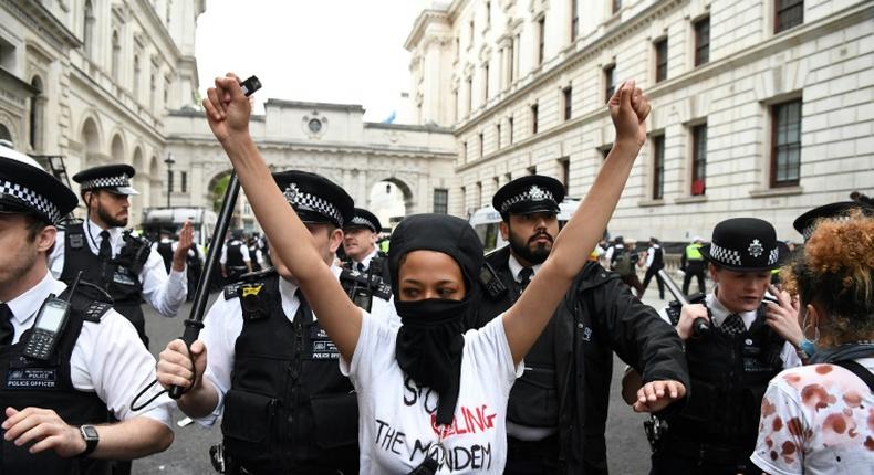 Protestors remonstrate with police officers during an anti-racism demonstration in London after George Floyd, an unarmed black man, died after a police officer knelt on his neck during an arrest in Minneapolis, USA.