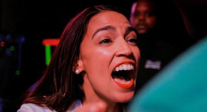 Alexandria Ocasio Cortez celebrates her election win.