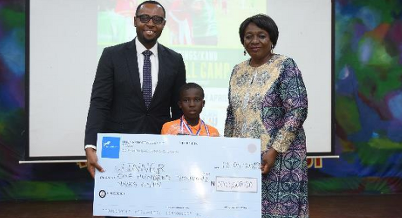 From Left - Sector lead, Union Bank, Emmanuel Essien;  one of the winners of the competition, Quadri Araromi and Director, Greensprings School, Ms. Lai Koiki, at the award ceremony.