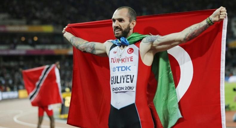 Turkey's Ramil Guliyev celebrates after winning the final of the men's 200m athletics event at the 2017 IAAF World Championships at the London Stadium in London on August 10, 2017