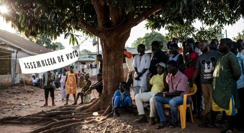 Officials count first-round votes at a polling station in the popular Bairro Militar area of Bissau in November 2019