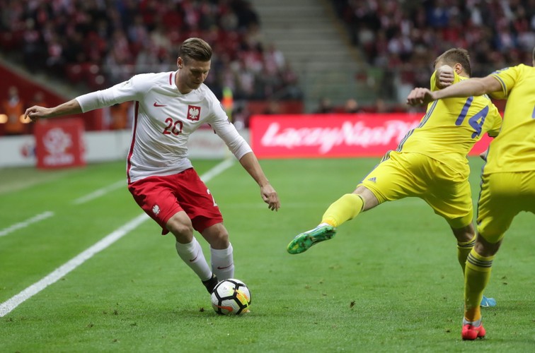 Łukasz Piszczek (L) i Roman Murtazajew (P)