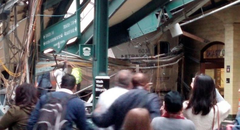 Onlookers view a New Jersey Transit train that derailed and crashed through the station in Hoboken, New Jersey, U.S. in this picture courtesy of Chris Lantero taken September 29, 2016.