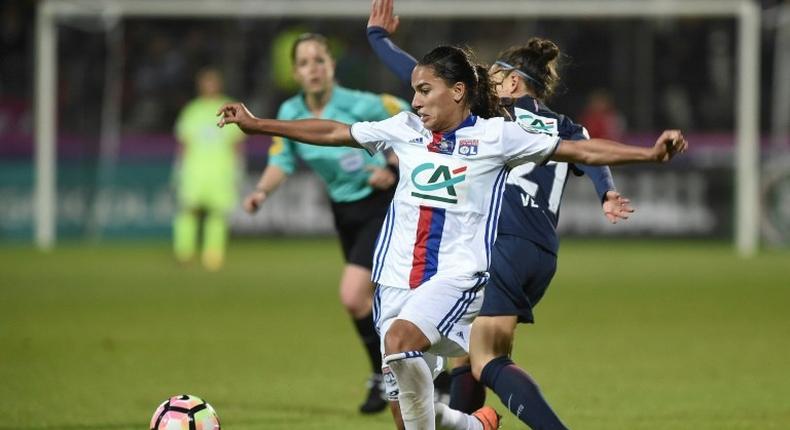 Lyon's Amel Majri (L) vies with Paris Saint-Germain's Veronica Boquete during the women's French Cup football finale match on May 19, 2017