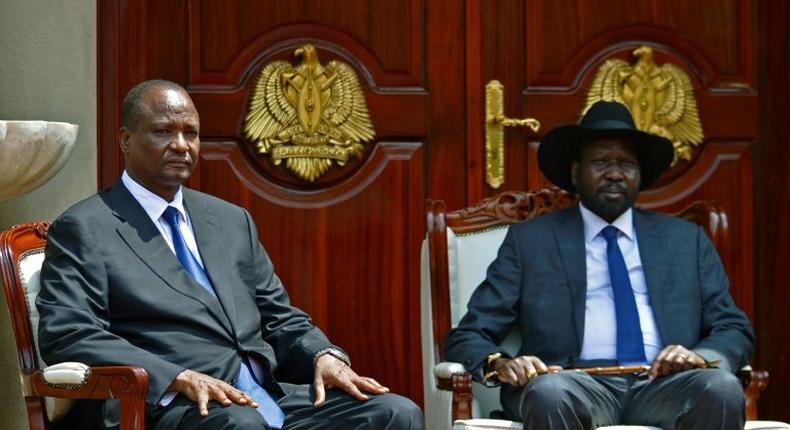 Newly appointed Vice President of South Sudan, Taban Deng Gai (L) and South Sudan's President Salva Kiir (R) pose at State House, in Juba on July 26, 2016 