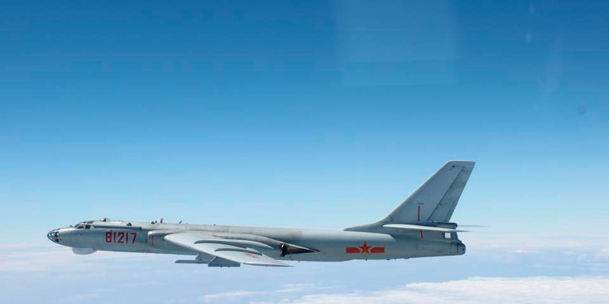 A Chinese military plane H-6 bomber flies through airspace between Okinawa prefecture's main island and the smaller Miyako island in southern Japan, out over the Pacific, in this handout photo taken on October 27, 2013.