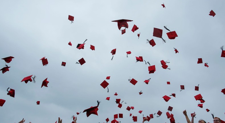 Students toss their hats at Wesleyan University's commencement ceremony in 2018.
