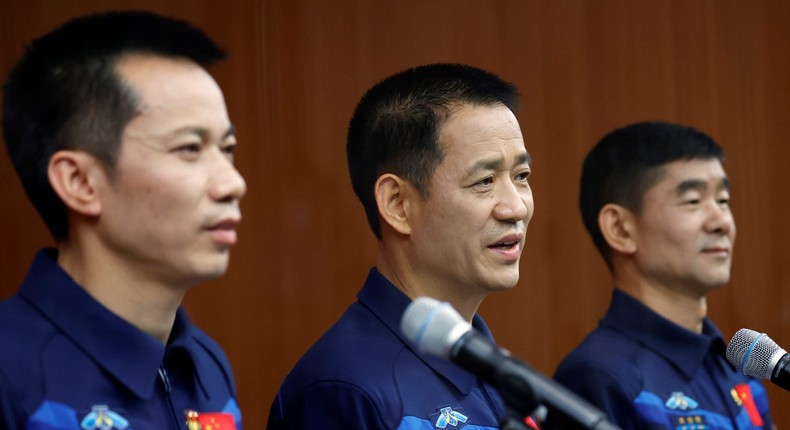 Chinese astronauts Nie Haisheng, Liu Boming, and Tang Hongbo speak at a press conference at Jiuquan Satellite Launch Center in Gansu province, China, June 16, 2021.
