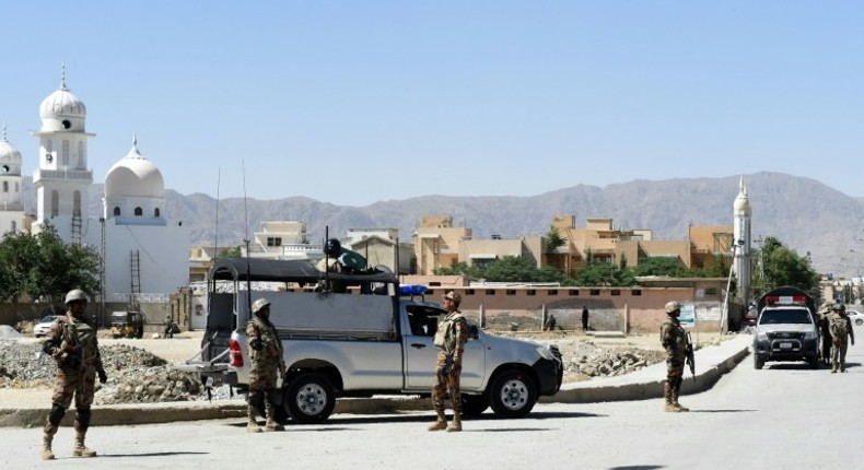 Pakistani soldiers stand guard at the site where a Chinese couple was kidnapped in Balochistan province, which is at the heart of a $50-billion project by Beijing but is racked by separatist and Islamist insurgencies