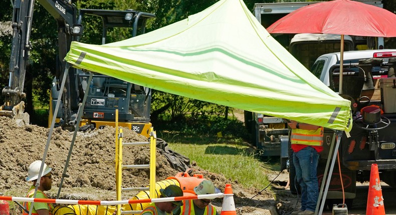 Utility workers used a tent to create shade while working on a gas line in Jackson, Mississippi, on Wednesday. High heat can be a risk for those who work outdoors.Rogelio V. Solis/Associated Press