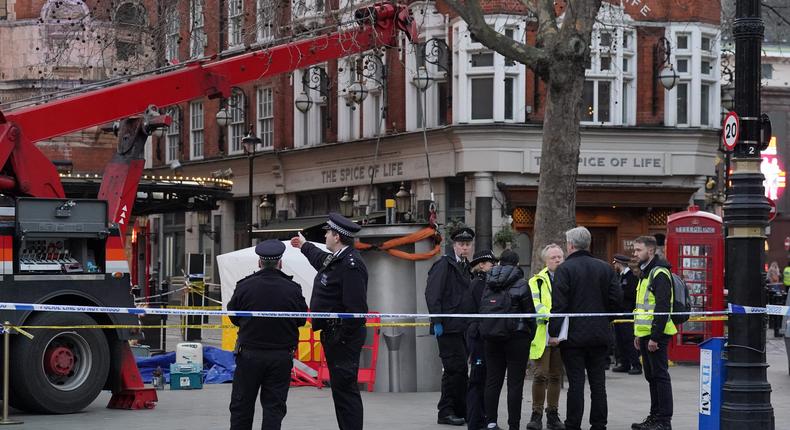 A crane lifts the street urinal police  at Cambridge Circus in central London, after a worker was crushed to death.Jonathan Brady/PA Images via Getty Images