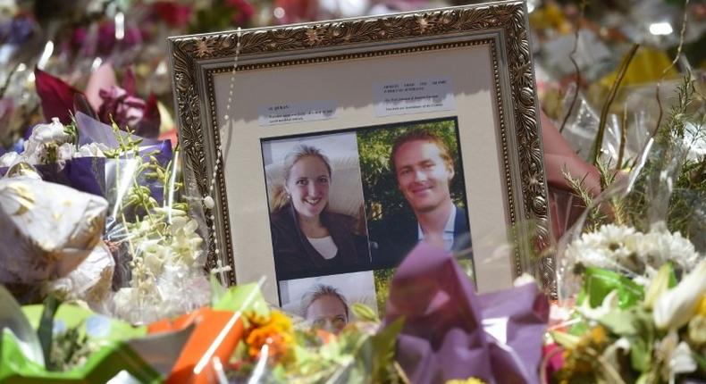 Photos showing Katrina Dawson (L) and Tori Johnson (R) sit amongst the floral tributes left outside the Lindt cafe in Sydney's Martin Place, one week after a deadly siege in December 2014