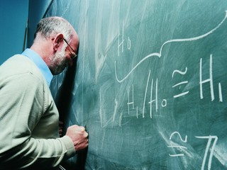 Portrait of a Frustrated Maths Lecturer Banging his Head Against a Blackboard